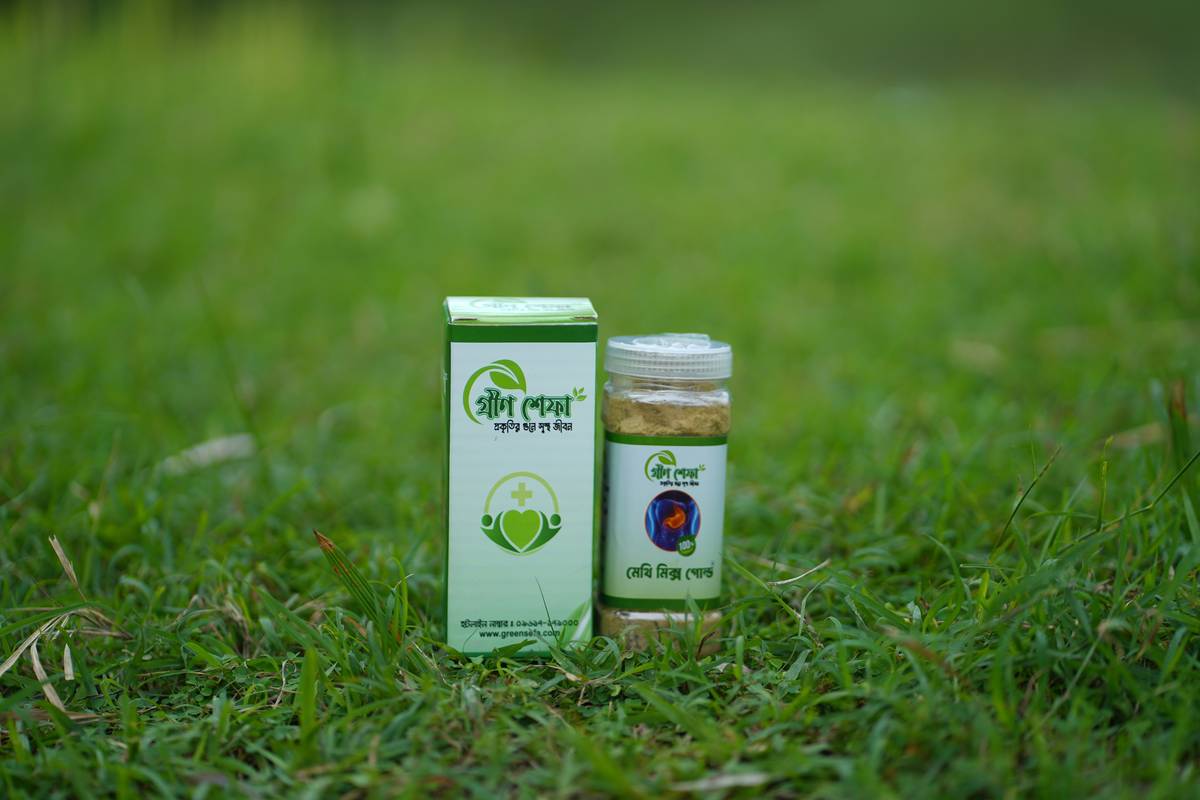 Traditional ancient ayurveda herbs like trikatu and ashwagandha arranged on wooden surface